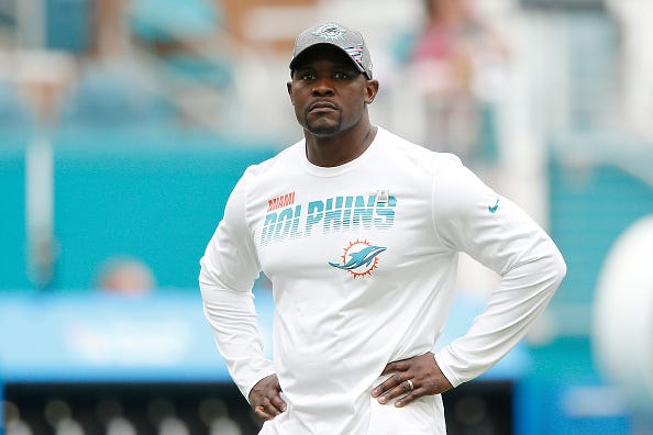 Brian Flores looks on before a Dolphins game.