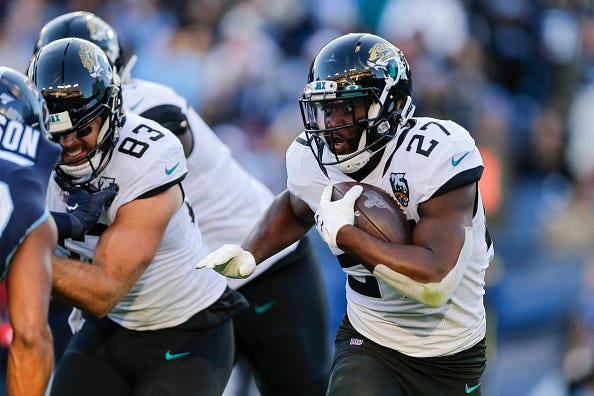Leonard Fournette looks for room to run behind his offensive line.