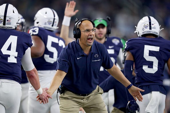 Penn State head coach James Franklin celebrates with his players.