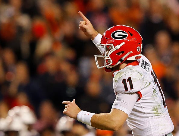 Jake Fromm celebrates a touchdown against Auburn.