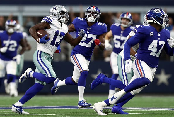 Michael Gallup runs through the Giants defense in Week 1.