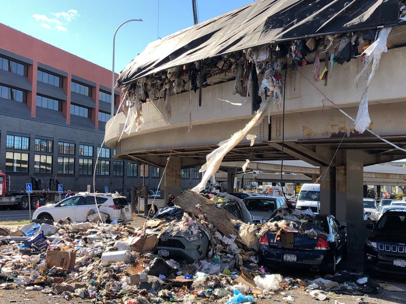 Garbage spills on parked cars in Buffalo