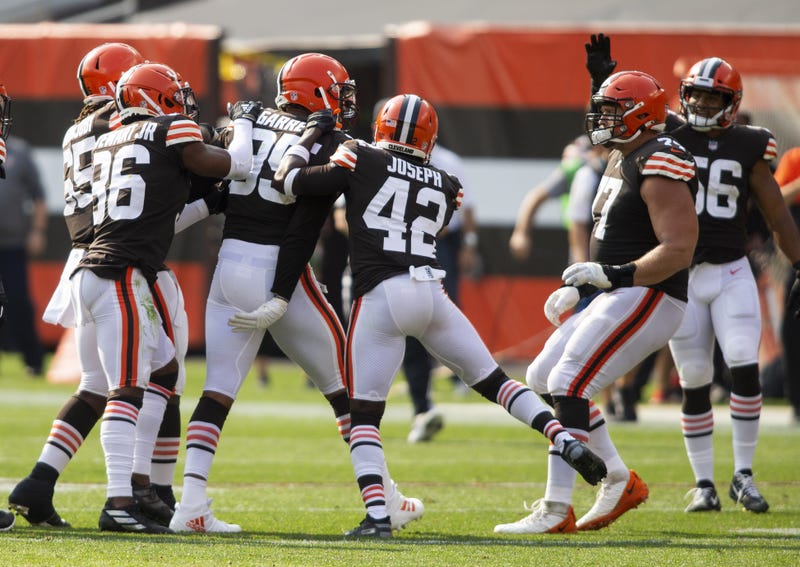 Cleveland Browns defensive end Myles Garrett celebrates his fumble recovery with cornerback M.J. Stewart and strong safety Karl Joseph against the Washington Football Team during the fourth quarter at FirstEnergy Stadium. The Browns won 34-20.