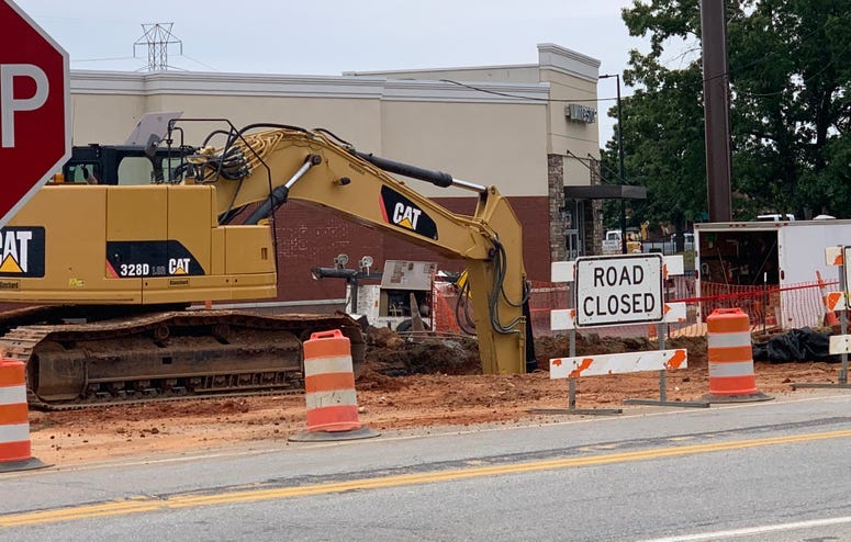 Road construction back hoe damages gas line on Garlington Road.