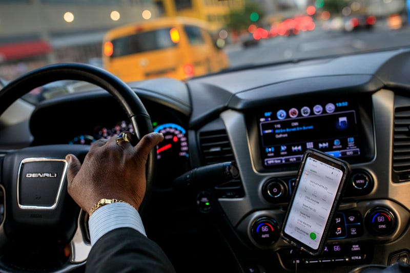 After dropping off passengers at a Broadway play, Johan Nijman, a for-hire driver who runs his own service and also drives for Uber on the side, drives through the West Side of Manhattan on Wednesday evening, August 8, 2018 in New York City.