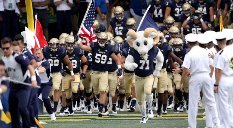 Navy football team takes the field