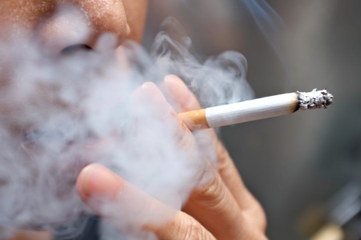 A person smoking a cigarette.