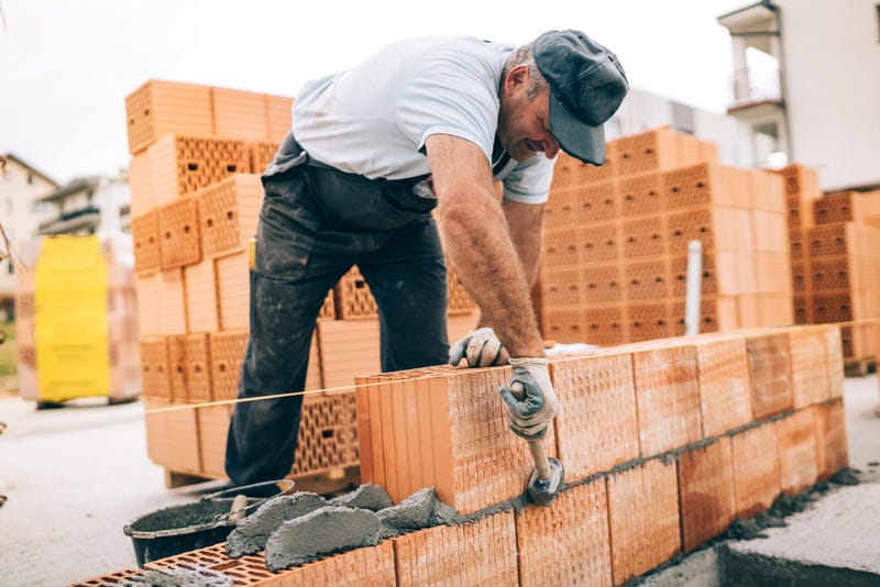 Man laying bricks