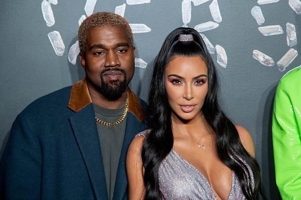 Kanye West and Kim Kardashian West attend the the Versace fall 2019 fashion show at the American Stock Exchange Building in lower Manhattan on December 02, 2018 in New York City.