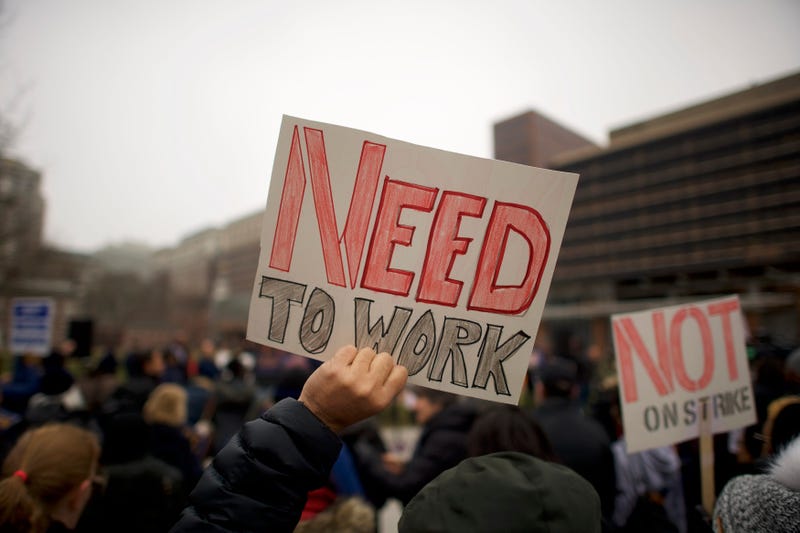 Fred Jennings, 67, holds a placard stating "NEED TO WORK" while gathering with area elected officials and furloughed federal workers at a rally in front of Independence Hall on Jan. 8, 2019 in Philadelphia, Pennsylvania.