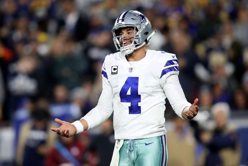 Cowboys quarterback Dak Prescott smiles during first half of game.