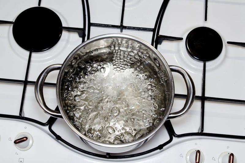 casserole with boiling water on the stove