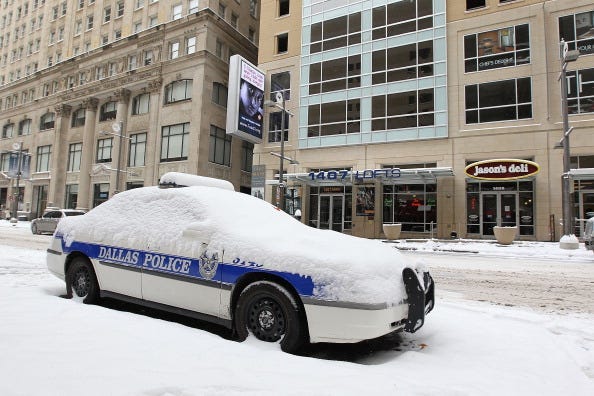 A Dallas Police car is covered in snow after a snowstorm hit the area February 4, 2011 in Dallas, Texas. More than four inches of snow fell overnight in the North Texas area. The Green Bay Packers will play the Pittsburgh Steelers in Super Bowl XLV on Feb