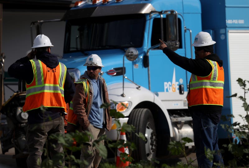 Pacific Gas and Electric (PG&E) workers remain at the scene of a three-alarm fire that started after a construction crew hit a gas line on February 07, 2019 in San Francisco, California.