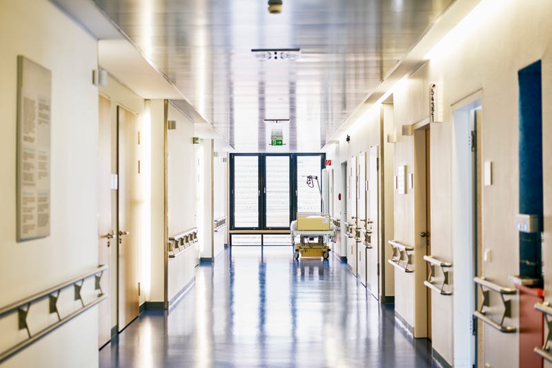 Hospital with corridor and bed without persons in landscape format