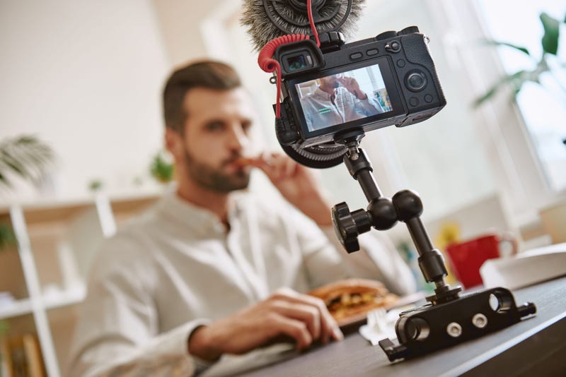 Guy making a food video