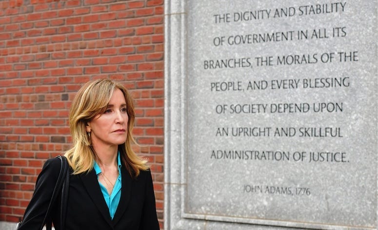 BOSTON, MA - APRIL 03: Felicity Huffman exits the John Joseph Moakley U.S. Courthouse after appearing in Federal Court to answer charges stemming from college admissions scandal on April 3, 2019 in Boston, Massachusetts.