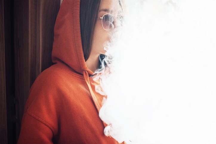 A girl vaping.