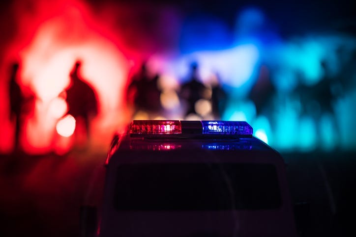 Police cars at night. Police car chasing a car at night with fog background.