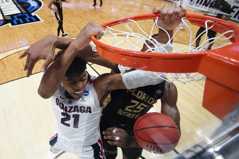 Rui Hachimura of the Gonzaga Bulldogs dunks the ball against Mfiondu Kabengele of the Florida State Seminoles during the 2019 NCAA Men's Basketball Tournament