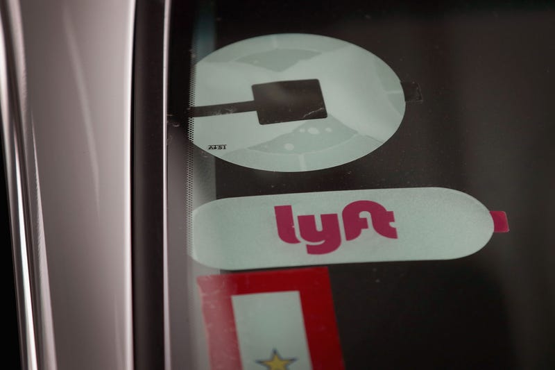 Uber and Lyft logos