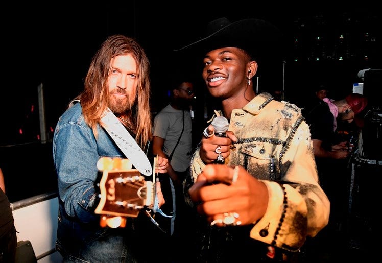INDIO, CALIFORNIA - APRIL 28: Billy Ray Cyrus (L) and Lil Nas X pose backstage during the 2019 Stagecoach Festival at Empire Polo Field on April 28, 2019 in Indio, California.