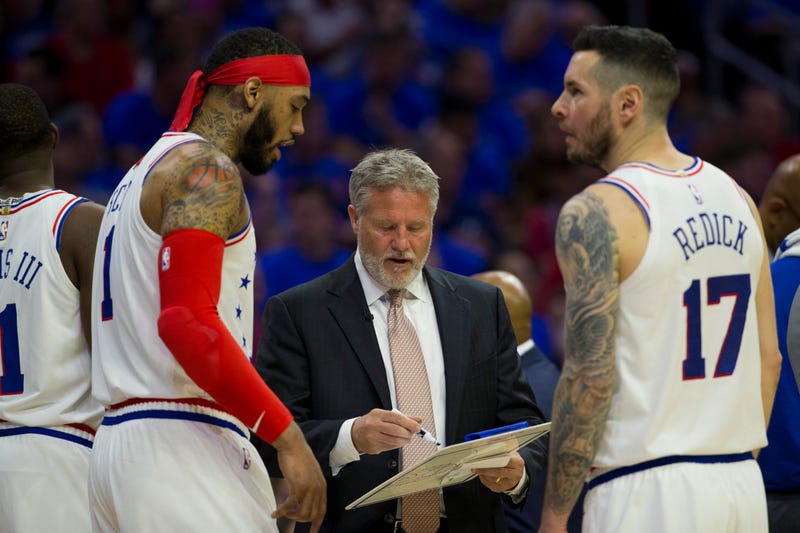 Brett Brown talks to Mike Scott and JJ Redick during Game Three.