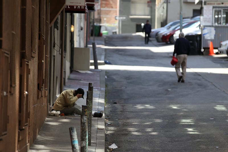 A homeless man sits on the sidewalk on May 17, 2019 in San Francisco.