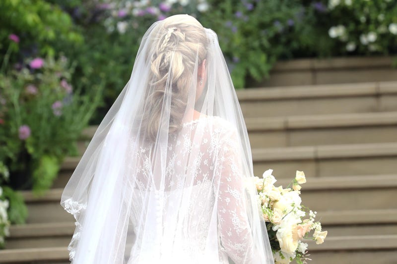 A bride walks down the aisle at an undated wedding.