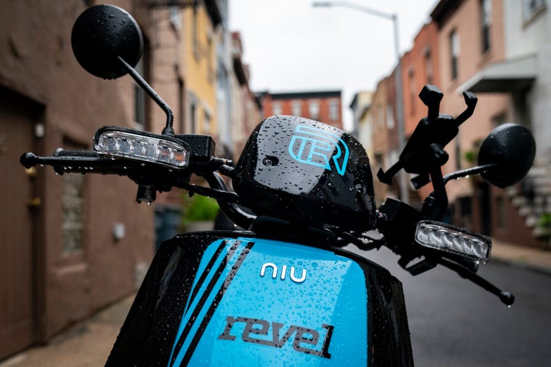 A Revel brand moped sits parked on a residential street, June 18, 2019 in the Brooklyn borough of New York City.