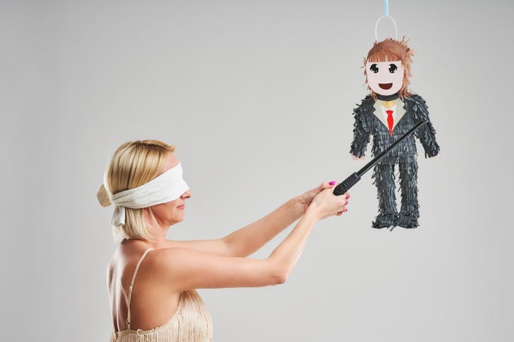 Picture of woman hitting male pinata over grey background