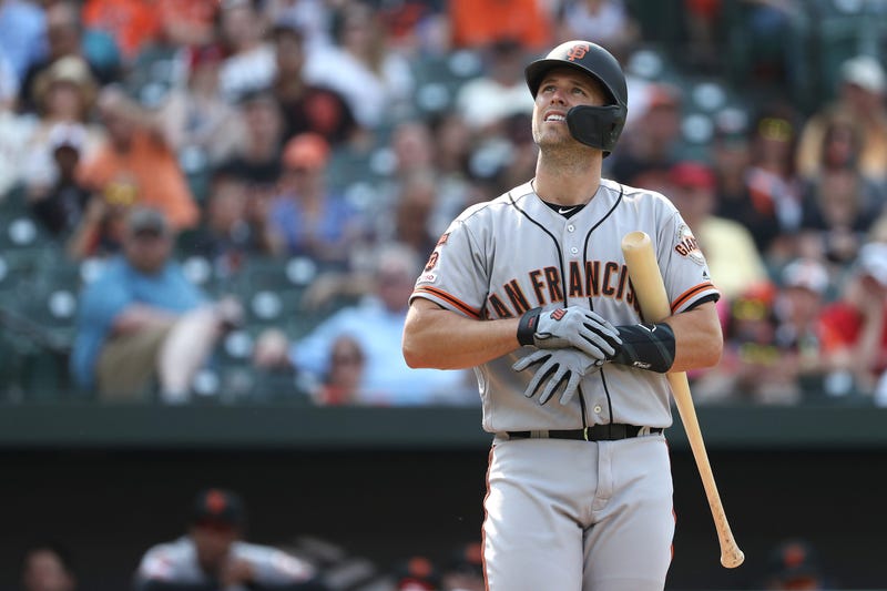 Buster Posey #28 of the San Francisco Giants looks on before batting against the San Francisco Giants at Oriole Park at Camden Yards on June 1, 2019 in Baltimore, Maryland.