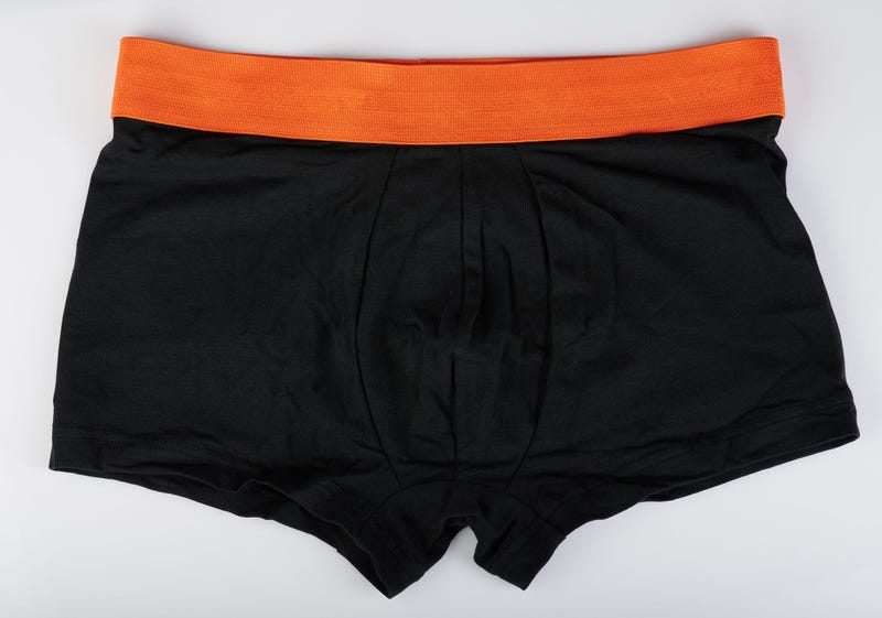 Black and orange men's boxer shorts flat isolated view