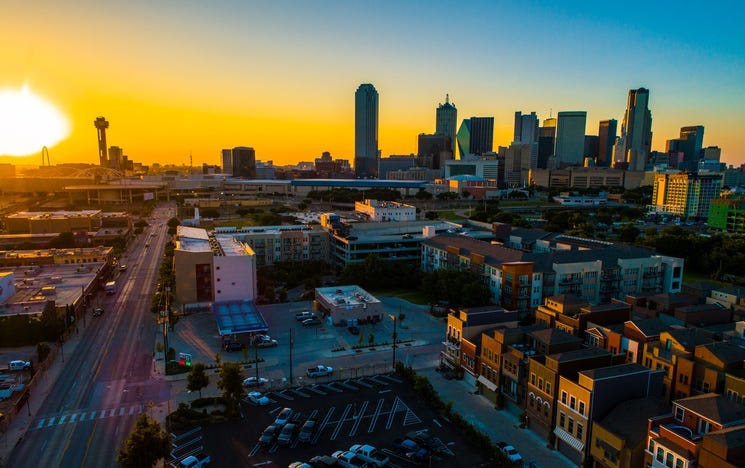 Aerial drone view Golden hour - Golden sun burst sunset over Dallas Texas Skyline Cityscape 2019
