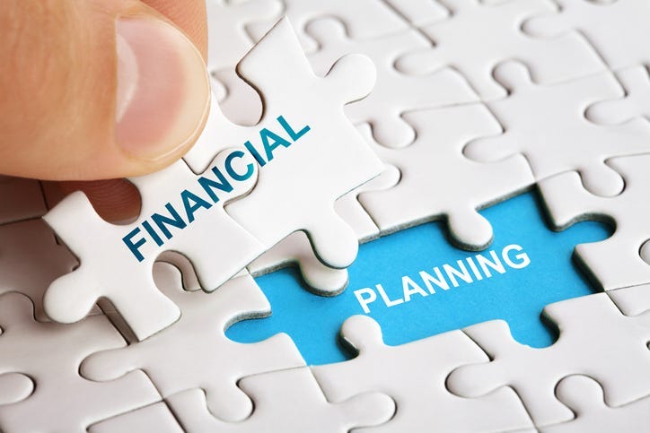 Piece of puzzle with words Financial Planning.