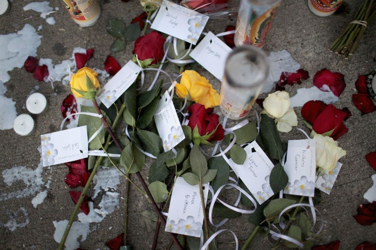DAYTON, OHIO - AUGUST 06: Flowers bearing the names of those killed in Sunday Morning's mass shooting sits along the sidewalk in the Oregon District on August 06, 2019 in Dayton, Ohio.