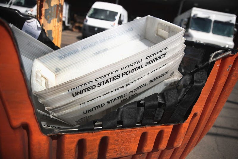 United States Postal Service boxes are stacked up.