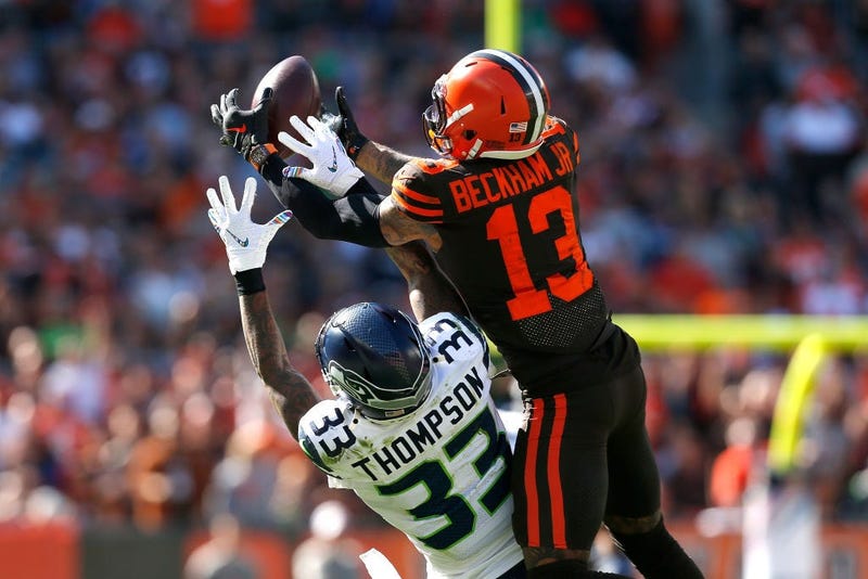 CLEVELAND, OH - OCTOBER 13: Odell Beckham Jr. #13 of the Cleveland Browns catches a pass over the defense of Tedric Thompson #33 of the Seattle Seahawks during the second quarter at FirstEnergy Stadium on October 13, 2019 in Cleveland, Ohio. (Photo by Kir