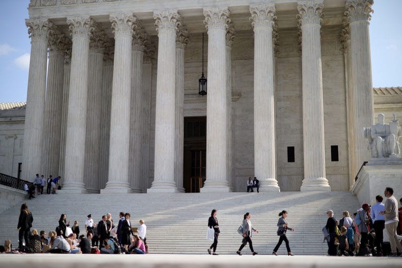 People wait in line with hundreds of others for the chance to attend arguments outside the U.S. Supreme Court building at the start of the court's new term October 07, 2019 in Washington, DC.