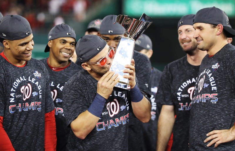 Gerardo Parra celebrates with the trophy after Nationals win Game 4 of the NLCS.