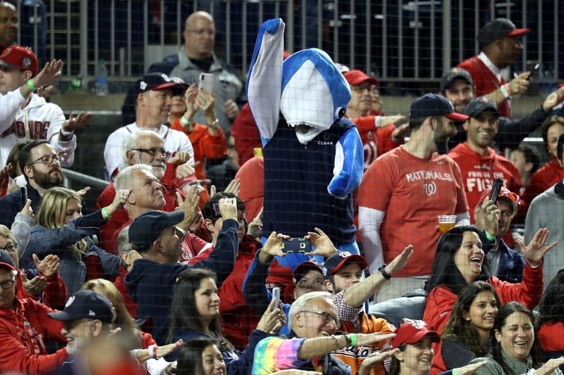 A fan in a shark costume Fans takes part in the Baby Shark song as Gerardo Parra bats.