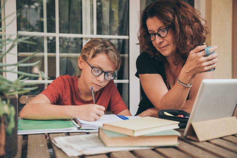 Child being taught at home through distance learning