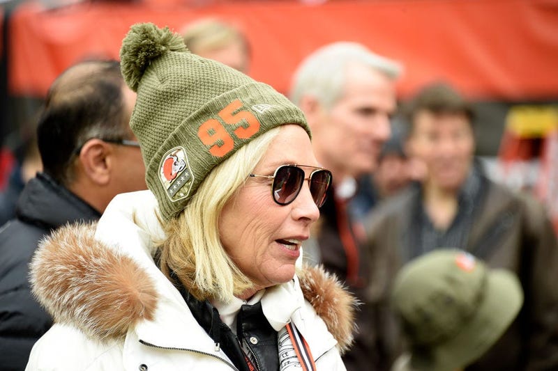 CLEVELAND, OHIO - NOVEMBER 24: Team owner Dee Haslam of the Cleveland Browns talks with guests on the sidelines while wearing a hat supporting defensive end Myles Garrett #95 prior to the game against the Miami Dolphins at FirstEnergy Stadium on November
