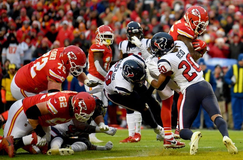 Damien Williams #26 of the Kansas City Chiefs rushes for a touchdown over Justin Reid #20 of the Houston Texans in the third quarter of the AFC Divisional playoff game at Arrowhead Stadium on January 12, 2020 in Kansas City, Missouri.