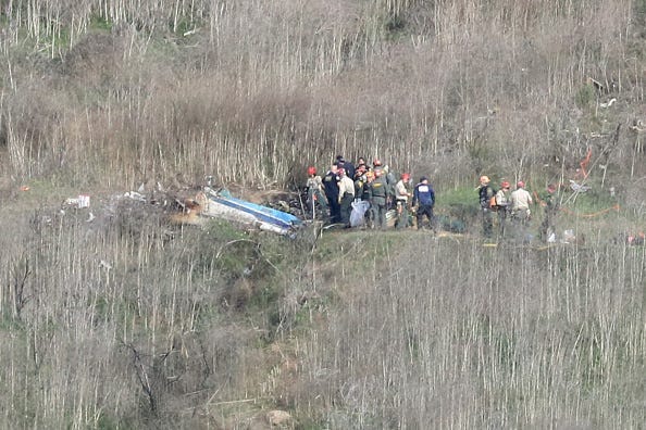Emergency personnel work at the helicopter crash site that claimed the life of former NBA great Kobe Bryant on January 27, 2020 in Calabasas, California. Bryant, 41, his daughter Gianna, 13, and seven others perished in the accident yesterday.