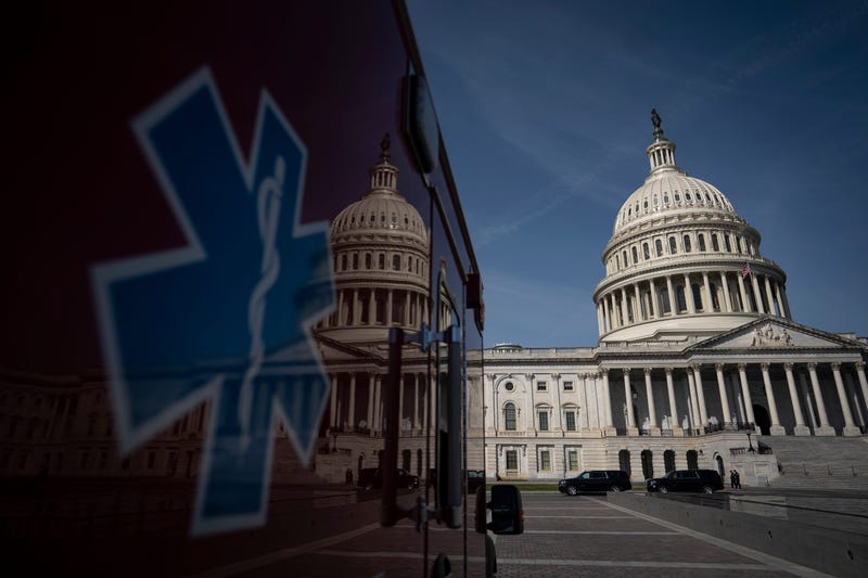 An ambulance sits parked on the plaza outside the U.S. Capitol March 16, 2020 in Washington, DC.