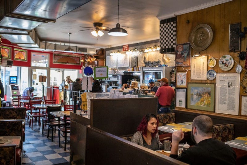 NEW YORK, NY - MARCH, 16: Patrons eat at Tom's Restaurant in the Prospect Heights neighborhood of Brooklyn on March 16, 2020 in New York City. In another measure to try and contain the spread of the Coronavirus all bars and restaurants were ordered to clo