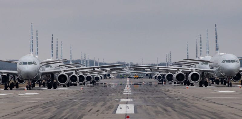Jets are parked on a runway at the Pittsburgh International Airport in Pittsburgh, Pennsylvania. Due to decreased flights as a result of the coronavirus (COVID-19) pandemic, planes are being stacked and parked at the airport.
