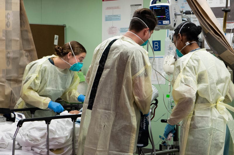 In this handout released by the U.S. Navy, Sailors assigned to the hospital ship USNS Mercy (T-AH 19) treat the first patient from Los Angeles medical facilities March 29.