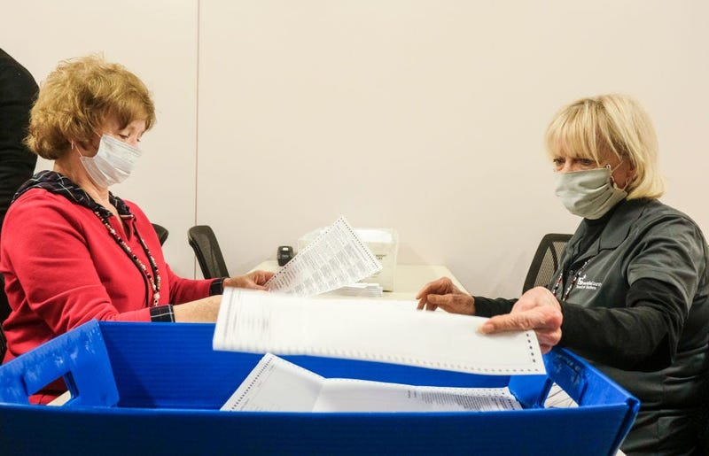 Employees and volunteers of the Franklin County Board of Elections sort through, and de-stub both mail in ballots and provisional ballots on April 28, 2020 in Columbus, Ohio